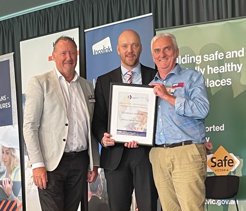 Terence Breen being presented with a certificate from CCF member for joining the Positive Plans Positive Futures Mental Health in Civil Construction Industry program